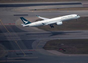 A Cathay Pacific plane takes off from HKG