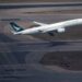 A Cathay Pacific plane takes off from HKG