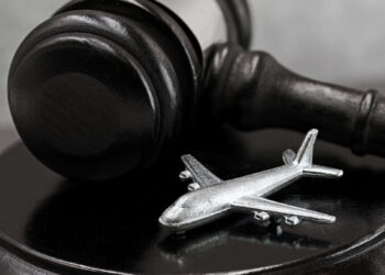 tiny airplane next to a gavel