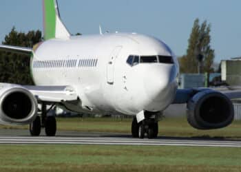An airplane taxis down a runway