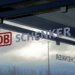 A closeup of the DB Schenker sign on a building