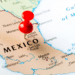 A map of Mexico with a push pin in it