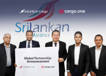 Five men stand in front of the SriLankan Cargo logo holding a sign announcing a partnership with cargo.one